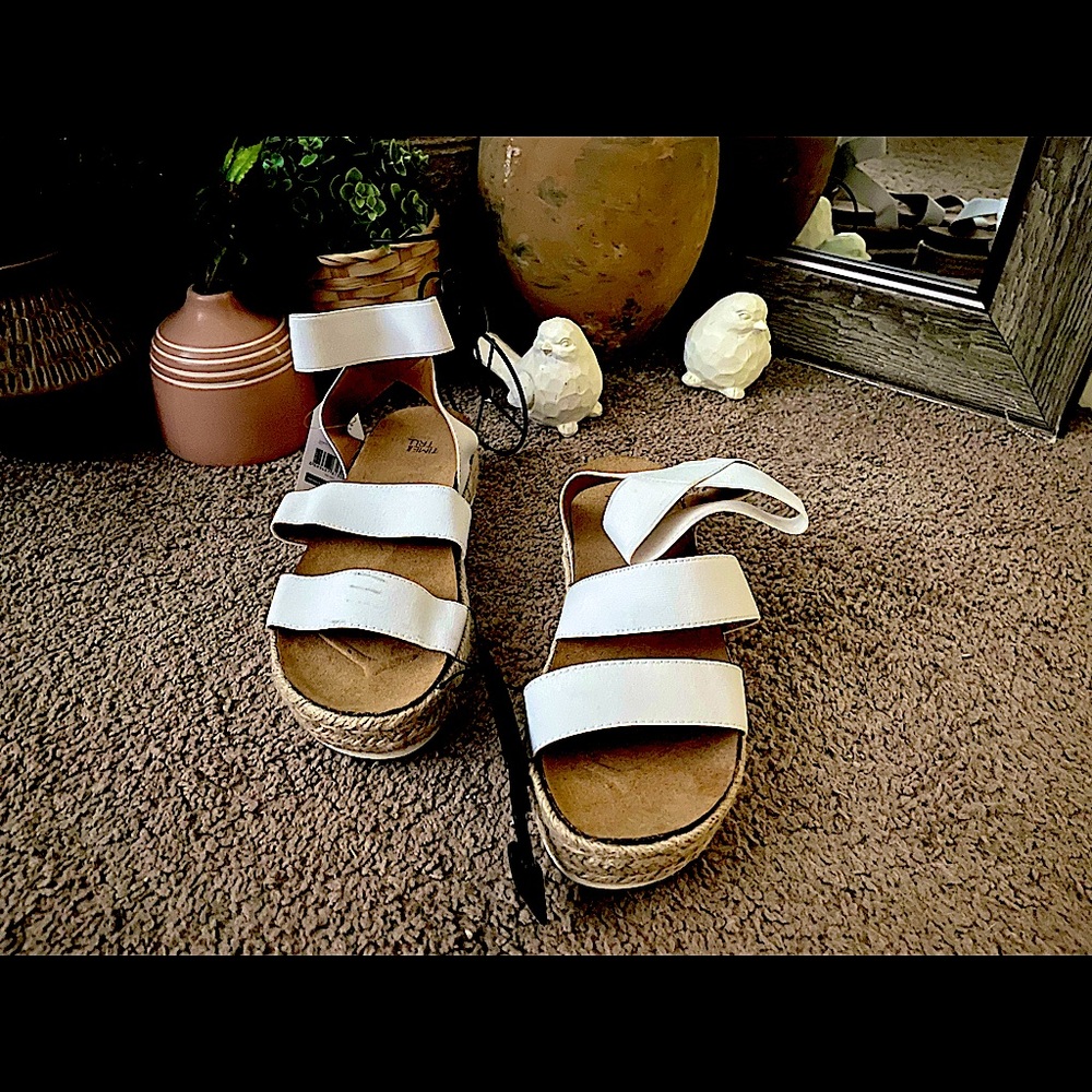Wedge ankle strapped sandals.